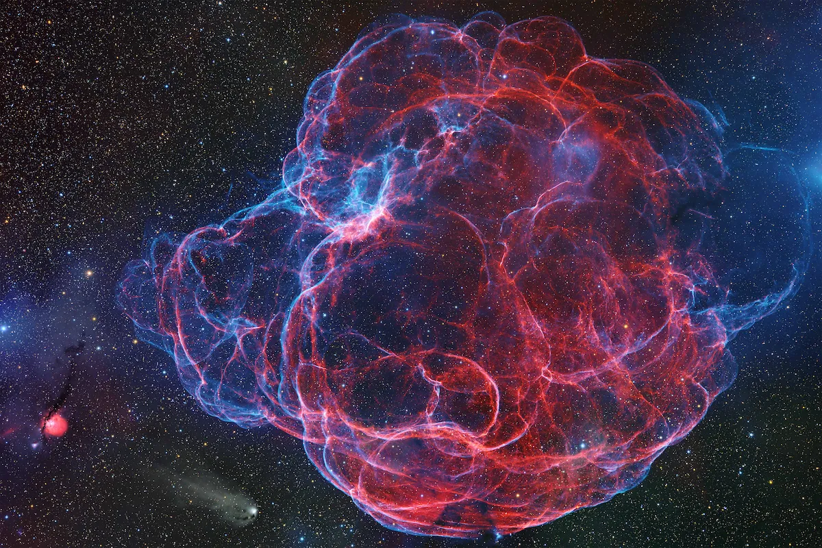 An image showing the delicate threadlike filaments of the Lightning Spaghetti Nebula against a dark star field